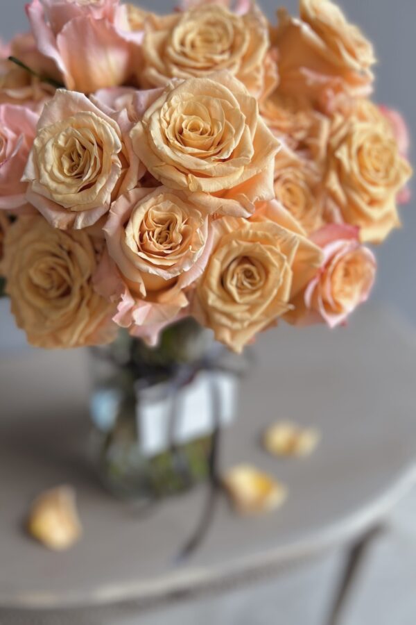 Orange roses in a vase by Lela Design 0