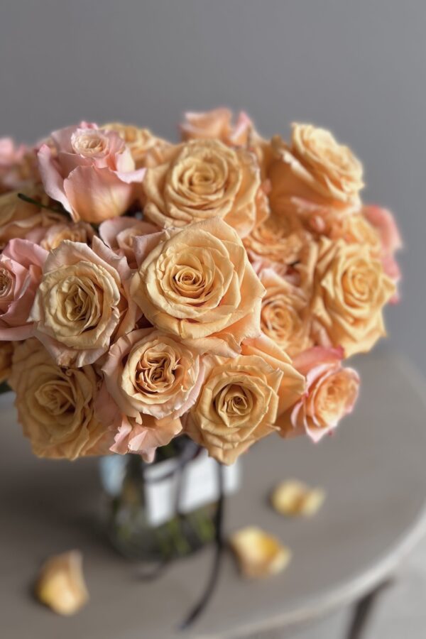 Orange roses in a vase by Lela Design 1