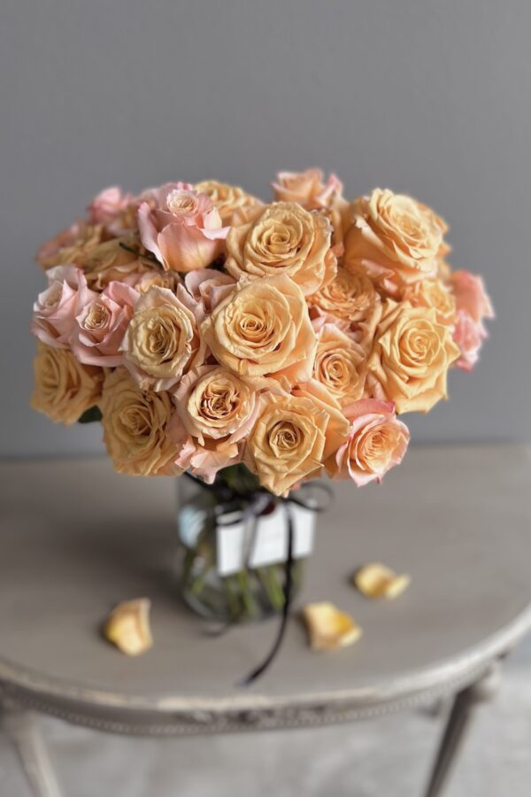 Orange roses in a vase by Lela Design 2