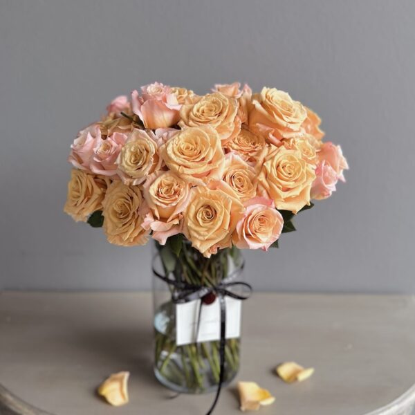 Orange roses in a vase by Lela Design 3