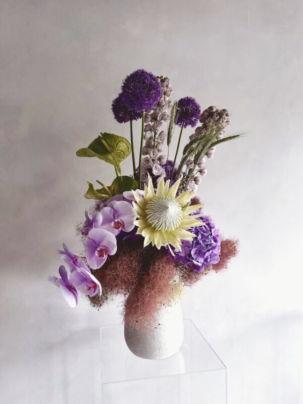 Extravagant flowers in a white vase