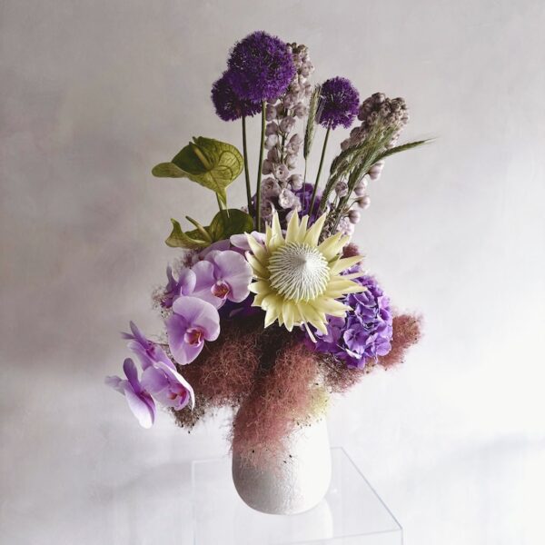 Extravagant flowers in a white vase