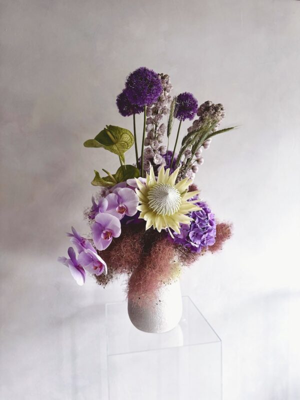 Extravagant flowers in a white vase