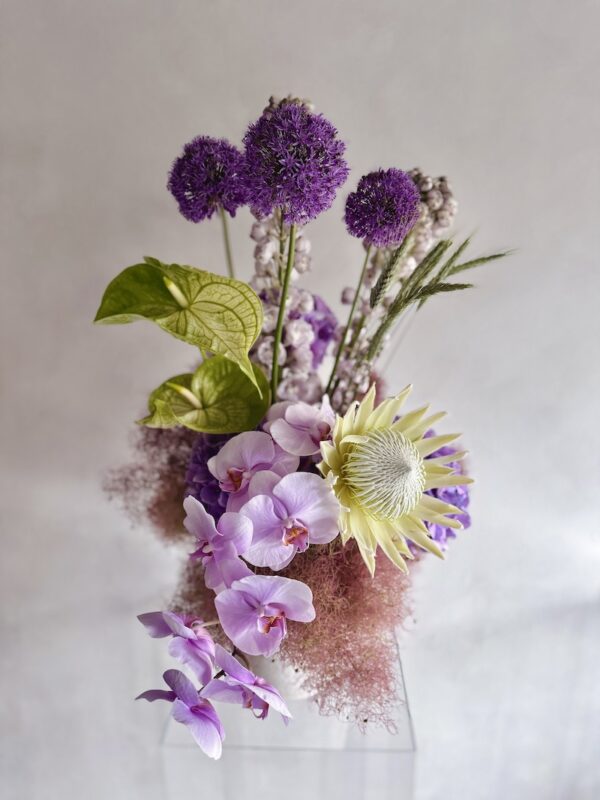 Extravagant flowers in a white vase
